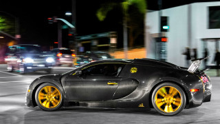 Black sports car yellow wheels - andrew law free wallpaper