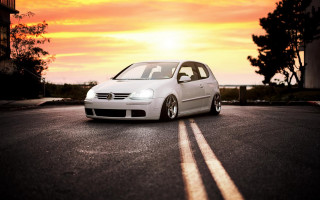 White car sunset autumn leaves - the side of a road free wallpaper