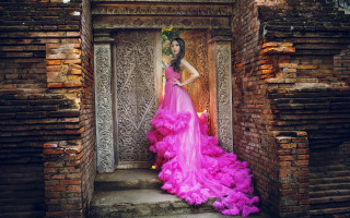 Pink dress woman doorway flower - her hair and a flower free wallpaper