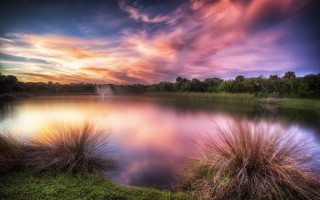 Lake fountain sunset mountains cityscape - a fountain in the middle of it free wallpaper