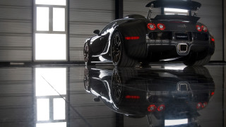Black sports car garage hood - a reflection free wallpaper