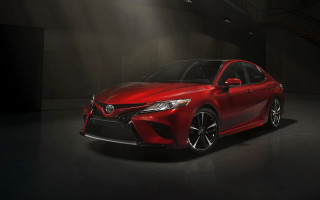Red car spotlight dark room - a spotlight free wallpaper