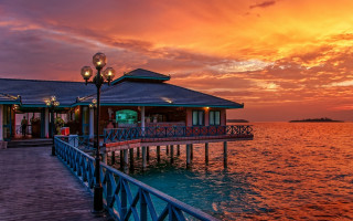 Pier lightpole building sunset clouds - a pier free wallpaper