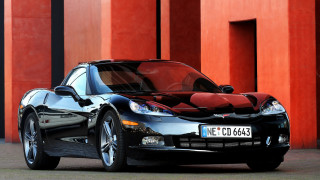 Black sports car red building - a black roof free wallpaper
