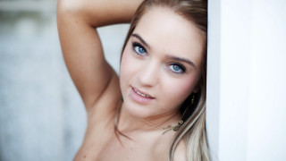 Beautiful young woman posing anna - her arm behind her head free wallpaper