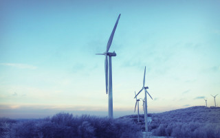 Wind turbines hill trees blue - a hill side free wallpaper