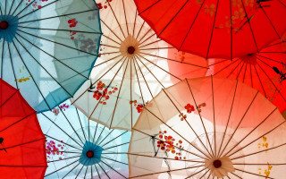Colorful umbrella hanging sky art - the air together free wallpaper