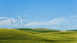 Wind turbines hill green grass - a hill side free wallpaper