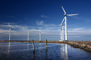 Wind turbines water rocks sky - rock free wallpaper