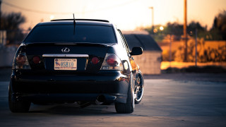 Black car sunset parking lot 2 - a black car free wallpaper