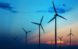 Wind turbines field sunset blue - a blue sky in the background free wallpaper for desktop