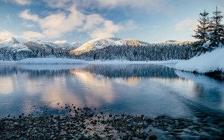 Lake snowy mountains reflection city - covered free wallpaper