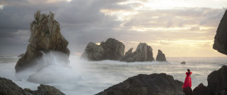 Woman red dress ocean waterfall - stormy weather free wallpaper