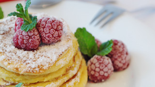 Pancakes raspberries powdered sugar flower - top of them free wallpaper