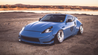 Blue sports car lake mountains - widescreen free wallpaper