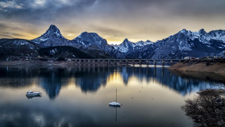Lake bridge boats mountains clouds - derold page free wallpaper