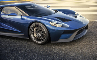 Blue sports car night sky - the side of the road in a parking lot free wallpaper