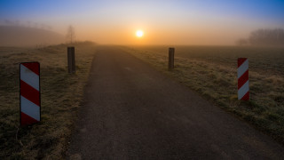 Road sign sunset foggy beach - the distance behind free wallpaper