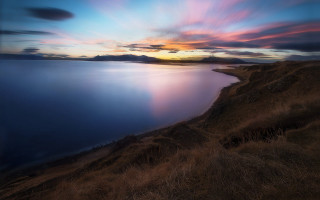 Sunset water hill clouds matte - a sunset over a body of water free wallpaper