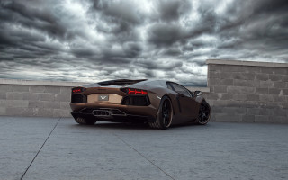 Brown sports car brick wall - cloudy free wallpaper