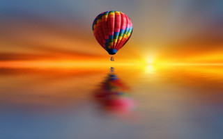 Hot air balloon sunset reflection - a hot air balloon free wallpaper