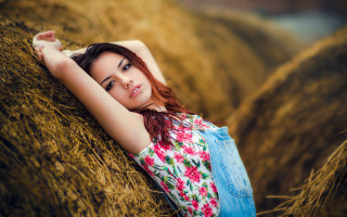 Woman hay bale field portrait - her arm free wallpaper