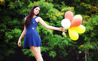 Woman blue dress balloons smiling - free happy birthday wallpaper