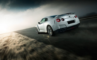 White sports car cloudy sky 15 - a sunbeam in the background free wallpaper