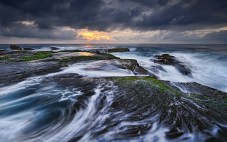 Sunset water waves rocks bridge - wave free wallpaper