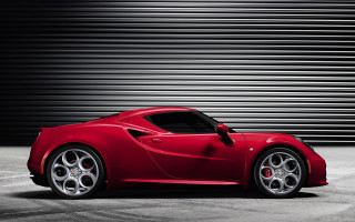 Red sports car garage black - a black wall behind free wallpaper
