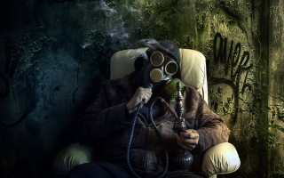 Man gasmask chair cigarette pipe - a man in a gas mask free wallpaper