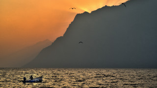 Boat birds sunset mountain ocean - mystical free wallpaper