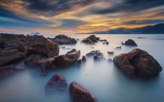 Mystical rocks sunset mountain reflection - a mountain range in the distance free wallpaper