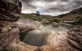 Small pool rocky area cloudy - cloudy free wallpaper