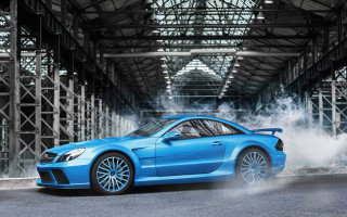 Blue sports car smoking garage - a garage free wallpaper