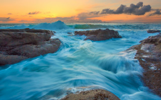 Sunset rocky beach waves foreground 2 - a sunset over a rocky beach free wallpaper