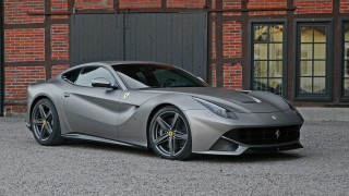 Silver sportscar brickbuilding door open - the side of it free wallpaper