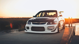 White car road water sunset - golden hour free wallpaper