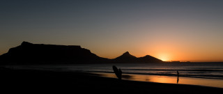 Beach sunset surfboard mountain portrait - a beach free wallpaper