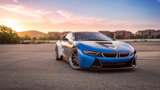 Blue sports car sunset city - a parking lot free wallpaper