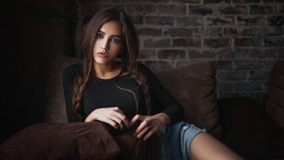 Woman sitting couch red face - a nose ring free wallpaper