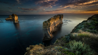 Sunset cliff lake island ocean - a large body of water free wallpaper