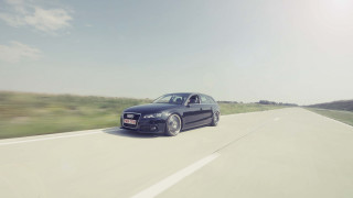 Black car driving road grass 2 - motion blur free wallpaper for desktop