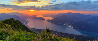 Sunset mountains lake clouds horizon - a sunset over a mountain free wallpaper