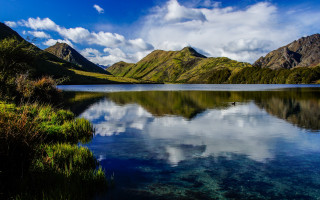 Lake mountains grass cloudy sky 7 - a lake free wallpaper