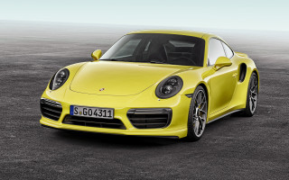Yellow porsche sports car parking - a parking lot free wallpaper