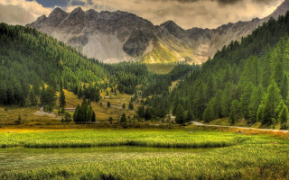 Grassy field mountain cloudy sky 3 - a grassy field free wallpaper