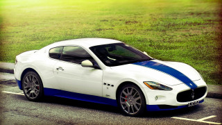 White blue sports car parking - a parking lot next free wallpaper