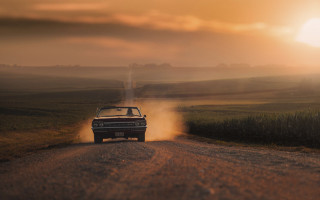 Car dirt road sunset dust - a car free wallpaper