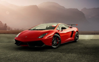 Red sports car mountains foggy - foggy sky above free wallpaper